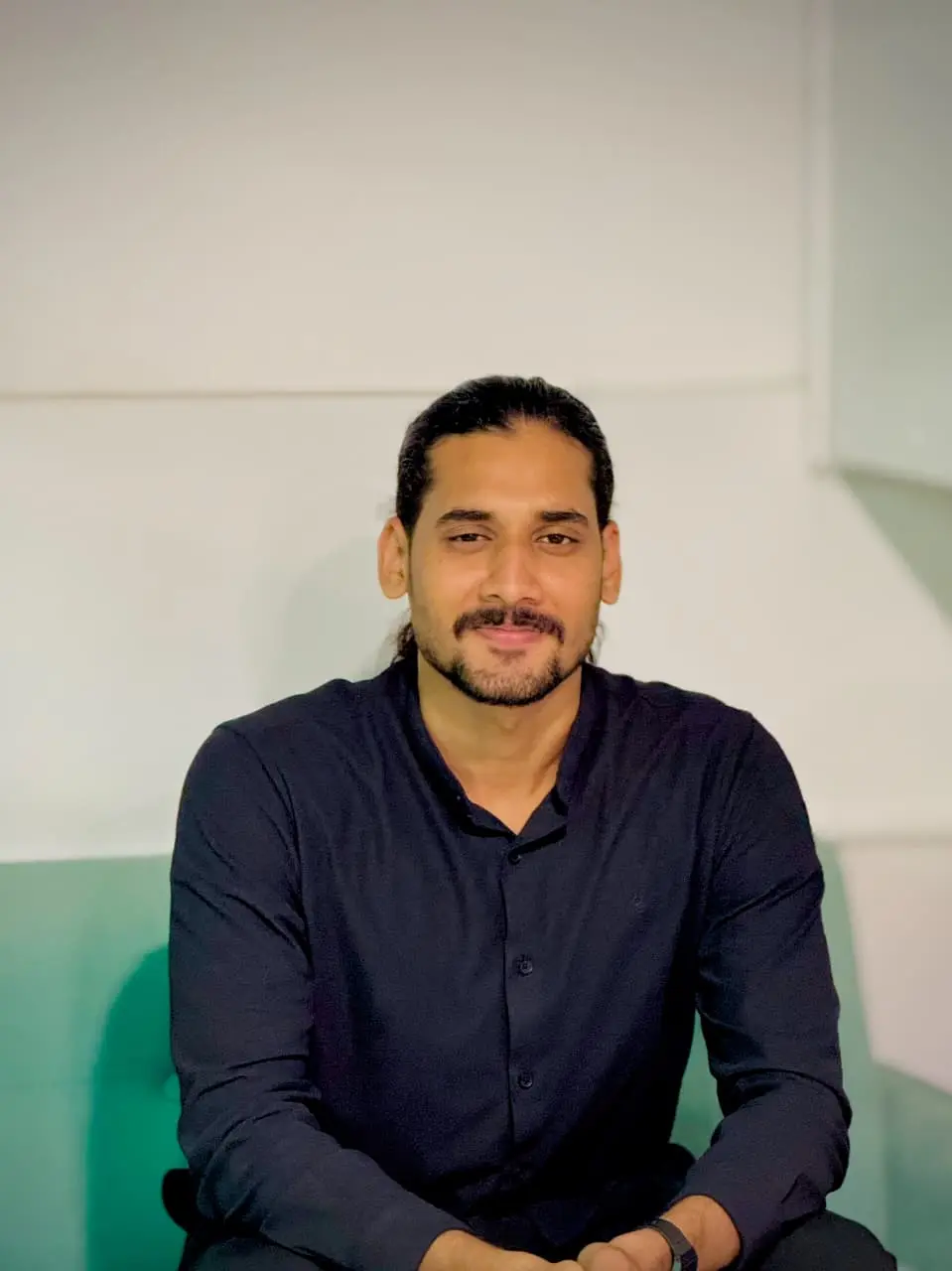 a long hair person looking at the camera